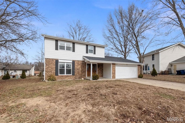 655 Lakewood Dr, Lake St Louis, MO 63367 - traditional-style house with brick siding, a garage, and concrete driveway
