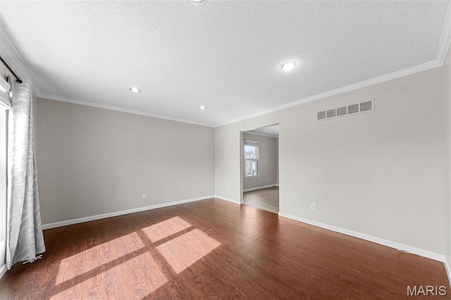 655 Lakewood Dr, Lake St Louis, MO 63367 - unfurnished room featuring dark wood-type flooring, baseboards, a textured ceiling, crown molding, and recessed lighting