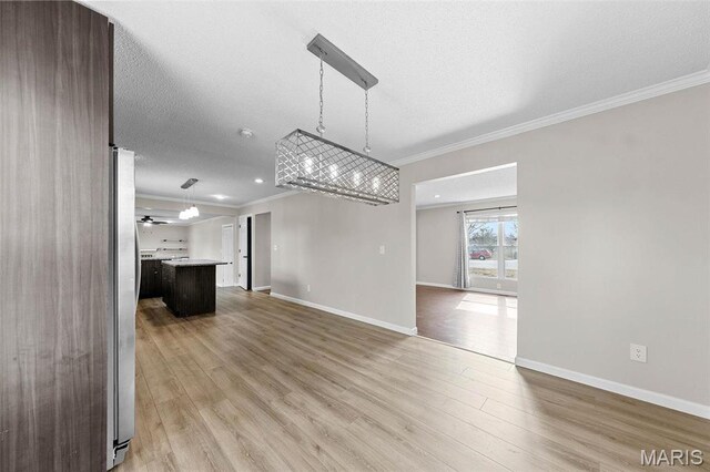 655 Lakewood Dr, Lake St Louis, MO 63367 - unfurnished living room with ornamental molding, wood finished floors, baseboards, recessed lighting, and a textured ceiling