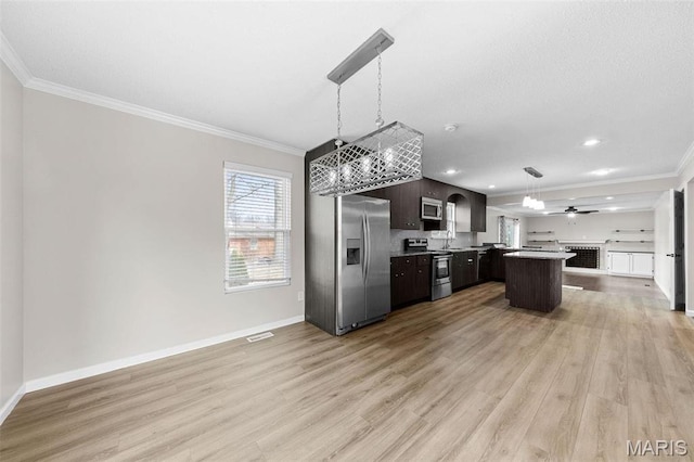 655 Lakewood Dr, Lake St Louis, MO 63367 - kitchen with appliances with stainless steel finishes, open floor plan, ornamental molding, dark brown cabinets, and light wood-style floors