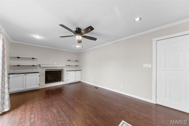 655 Lakewood Dr, Lake St Louis, MO 63367 - unfurnished living room with a fireplace with raised hearth, ceiling fan, dark wood-style flooring, ornamental molding, and baseboards