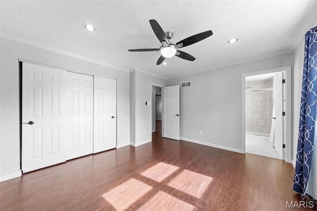 655 Lakewood Dr, Lake St Louis, MO 63367 - unfurnished bedroom with wood finished floors, a closet, a textured ceiling, baseboards, and recessed lighting