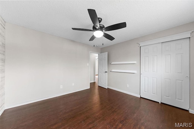 655 Lakewood Dr, Lake St Louis, MO 63367 - unfurnished bedroom with wood finished floors, baseboards, a closet, a textured ceiling, and a ceiling fan