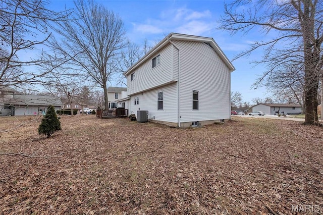 655 Lakewood Dr, Lake St Louis, MO 63367 - view of property exterior featuring central AC and a wooden deck