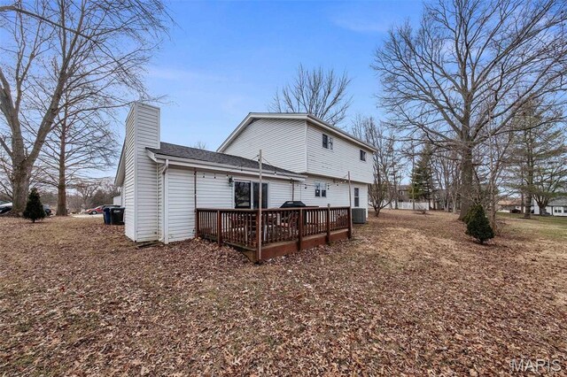 655 Lakewood Dr, Lake St Louis, MO 63367 - back of property with a chimney, a wooden deck, and cooling unit