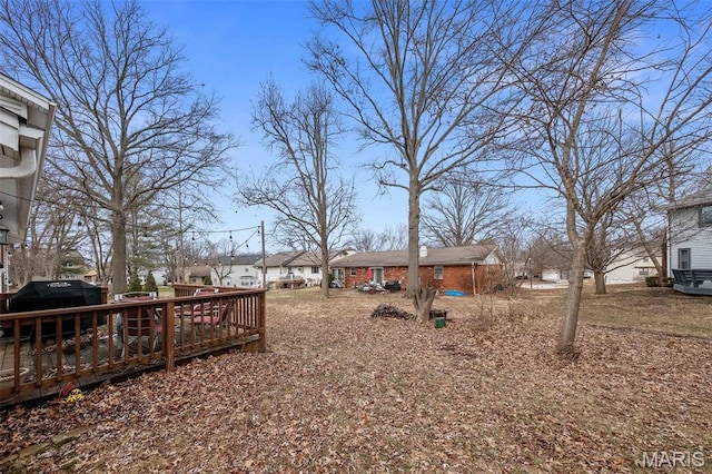 655 Lakewood Dr, Lake St Louis, MO 63367 - view of yard with a deck and a residential view