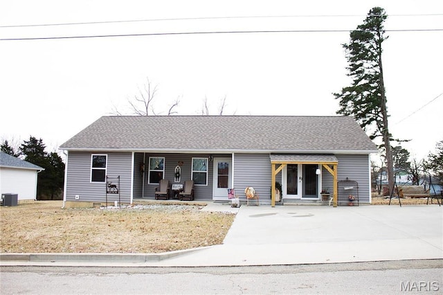 1303 W Coffman St, Salem, MO 65560 - view of front of home featuring covered porch, a shingled roof, and central AC unit