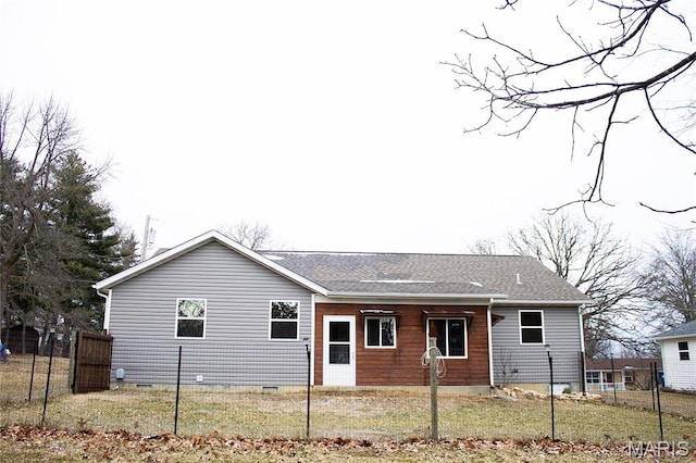 1303 W Coffman St, Salem, MO 65560 - back of property with fence, crawl space, and roof with shingles
