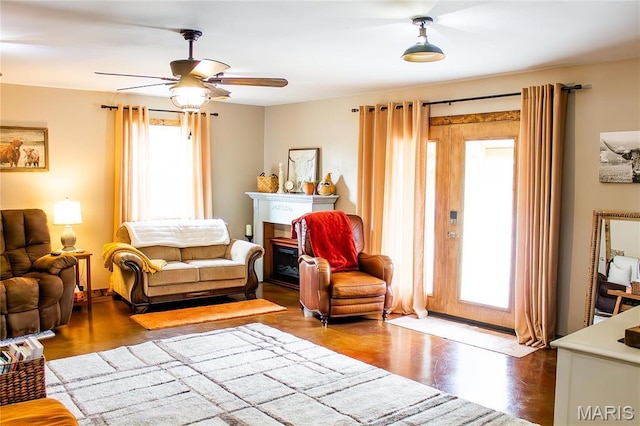 1303 W Coffman St, Salem, MO 65560 - living area with a fireplace, a ceiling fan, and wood finished floors