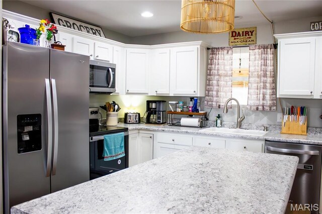 1303 W Coffman St, Salem, MO 65560 - kitchen featuring stainless steel appliances, a sink, white cabinetry, and recessed lighting