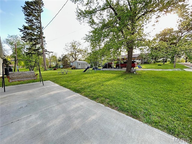 1303 W Coffman St, Salem, MO 65560 - view of green lawn with a playground and a storage shed
