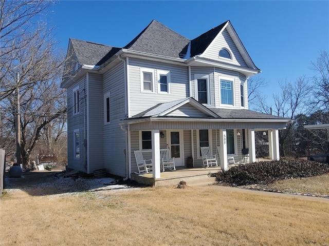 508 S Grand Ave, Houston, MO 65483 - victorian-style house with covered porch, a front yard, and roof with shingles