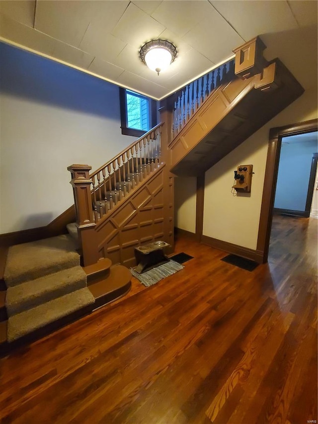 508 S Grand Ave, Houston, MO 65483 - staircase featuring baseboards and wood finished floors