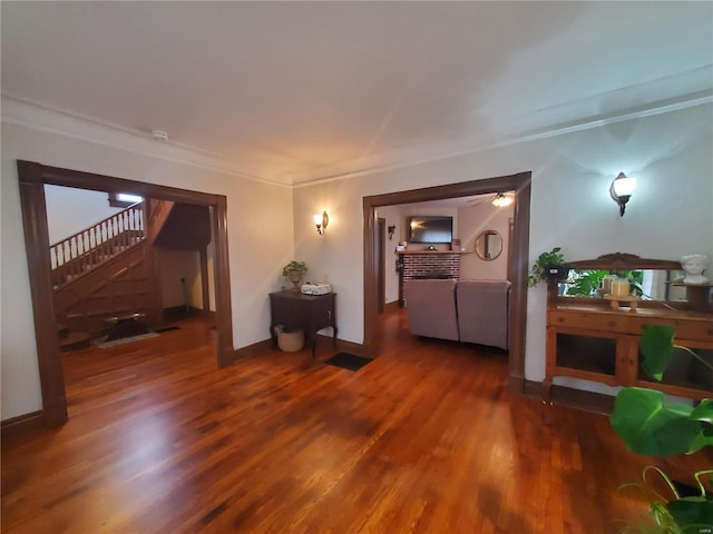 508 S Grand Ave, Houston, MO 65483 - living room with stairs, wood finished floors, ornamental molding, and baseboards