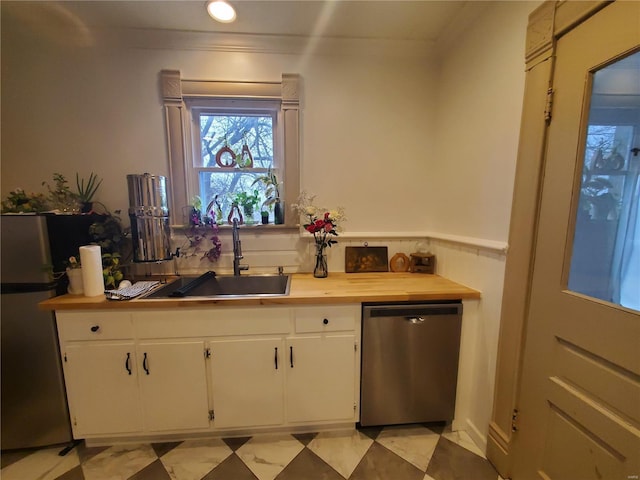 508 S Grand Ave, Houston, MO 65483 - kitchen featuring stainless steel appliances, a sink, white cabinetry, crown molding, and recessed lighting