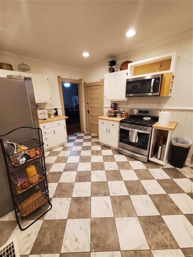 508 S Grand Ave, Houston, MO 65483 - kitchen featuring stainless steel appliances, white cabinetry, light countertops, and recessed lighting
