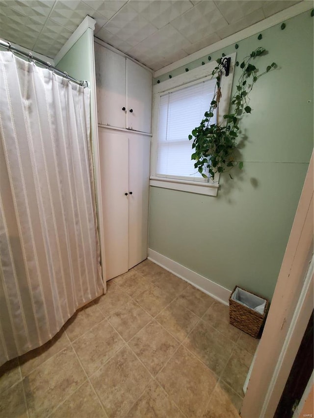 508 S Grand Ave, Houston, MO 65483 - full bathroom featuring tile patterned flooring, baseboards, and curtained shower