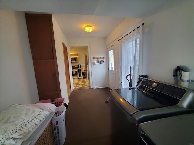 508 S Grand Ave, Houston, MO 65483 - clothes washing area with dark colored carpet, washing machine and dryer, and baseboards
