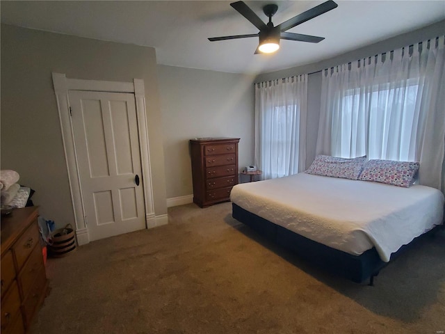 508 S Grand Ave, Houston, MO 65483 - bedroom with light colored carpet and a ceiling fan