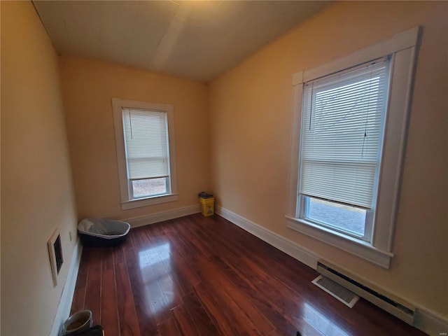 508 S Grand Ave, Houston, MO 65483 - unfurnished room with dark wood-type flooring, healthy amount of natural light, and baseboards