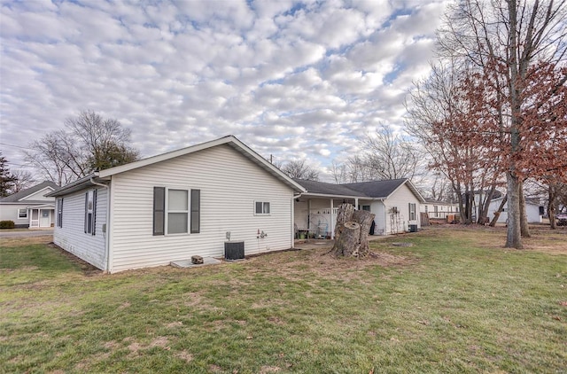 403 S Maple St Unit 403-405, Staunton, IL 62088 - back of property with a yard and central AC unit