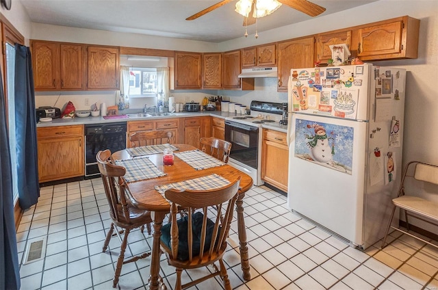 403 S Maple St Unit 403-405, Staunton, IL 62088 - kitchen featuring white appliances, under cabinet range hood, light countertops, a sink, and brown cabinets