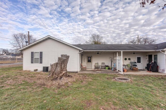 403 S Maple St Unit 403-405, Staunton, IL 62088 - rear view of house featuring a ceiling fan, central AC unit, a lawn, a patio, and a fire pit