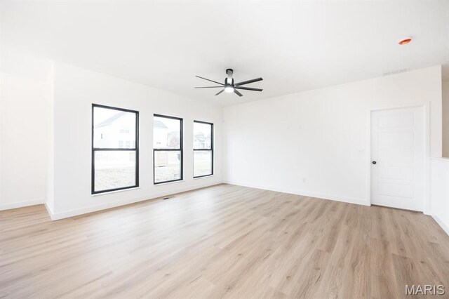 108 Chickasaw Ln, Ofallon, IL 62269 - empty room featuring ceiling fan, light wood-style flooring, and baseboards