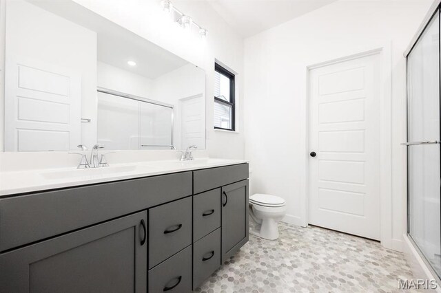 108 Chickasaw Ln, Ofallon, IL 62269 - bathroom featuring a shower stall, toilet, and double vanity