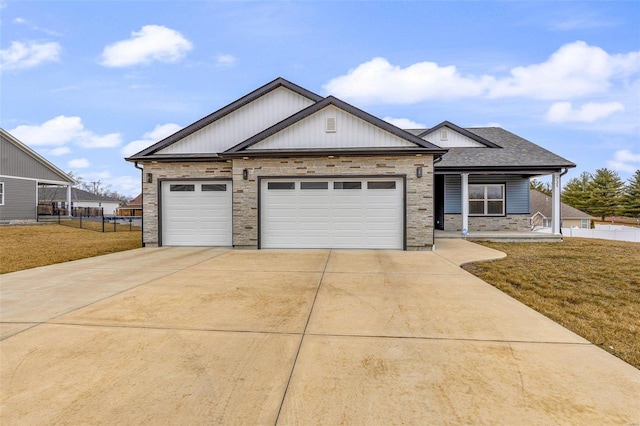 725 Deerfield Ln, Farmington, MO 63640 - view of front of property featuring driveway, stone siding, and a garage