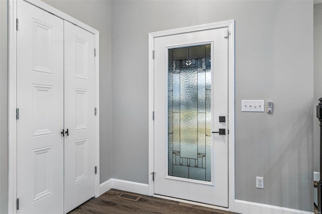 725 Deerfield Ln, Farmington, MO 63640 - doorway to outside featuring baseboards and dark wood-type flooring