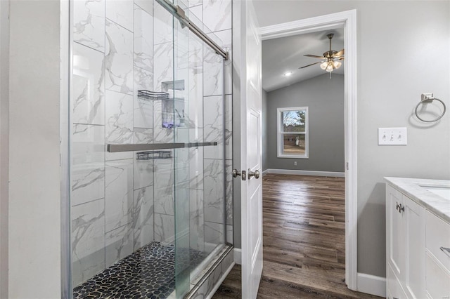 725 Deerfield Ln, Farmington, MO 63640 - full bath featuring vaulted ceiling, wood finished floors, a ceiling fan, a marble finish shower, and baseboards