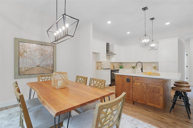 128 Valley Brooke Ct Unit 3Sjm, Washington, MO 63090 - dining space featuring light wood-style floors, a chandelier, and recessed lighting