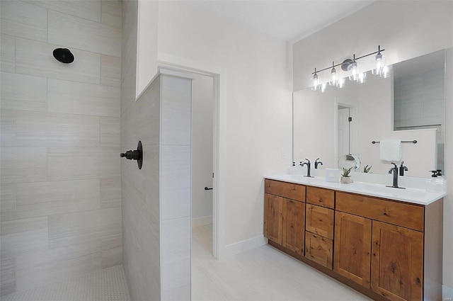 128 Valley Brooke Ct Unit 3Sjm, Washington, MO 63090 - bathroom featuring double vanity, tiled shower, and tile patterned flooring