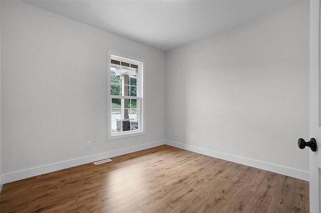 128 Valley Brooke Ct Unit 3Sjm, Washington, MO 63090 - spare room featuring baseboards and wood finished floors