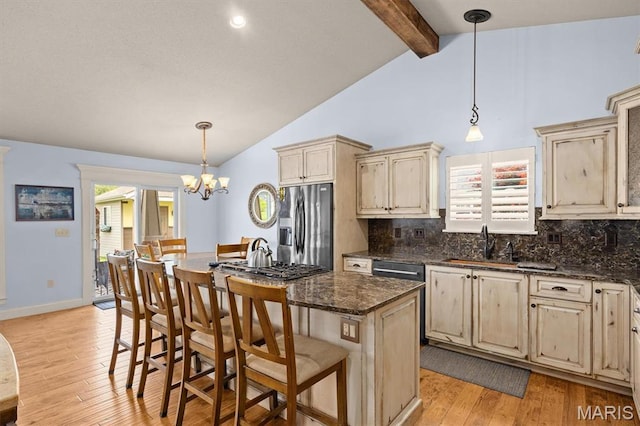 2016 Richview Dr, Saint Jacob, IL 62281 - kitchen with cream cabinetry, stainless steel fridge with ice dispenser, light wood-style floors, and tasteful backsplash