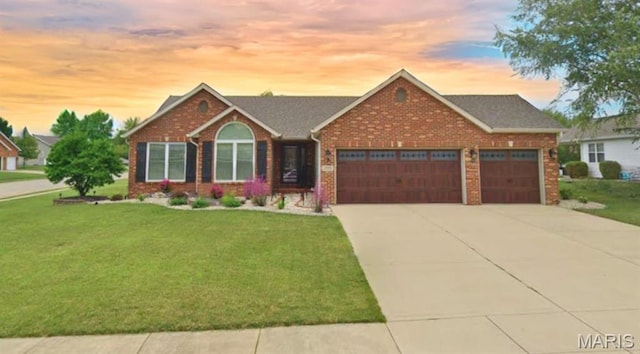 2016 Richview Dr, Saint Jacob, IL 62281 - ranch-style home featuring an attached garage, brick siding, a front lawn, and driveway