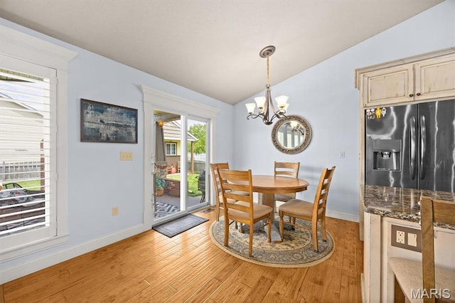 2016 Richview Dr, Saint Jacob, IL 62281 - dining room featuring vaulted ceiling, a chandelier, light wood-type flooring, and baseboards