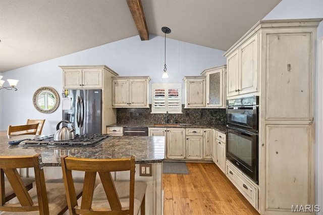 2016 Richview Dr, Saint Jacob, IL 62281 - kitchen featuring appliances with stainless steel finishes, cream cabinets, light wood-style floors, and backsplash