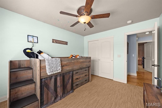 2016 Richview Dr, Saint Jacob, IL 62281 - bedroom featuring a closet, baseboards, ceiling fan, and light wood-style flooring