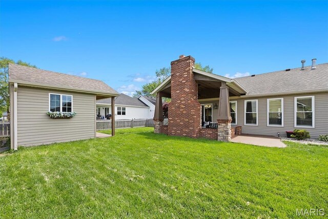 2016 Richview Dr, Saint Jacob, IL 62281 - back of property with a patio area, a chimney, and a shingled roof