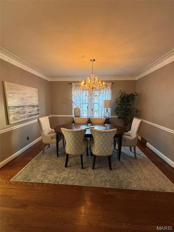 7810 Lafon Pl, University City, MO 63130 - dining area with wood finished floors, a chandelier, baseboards, and crown molding
