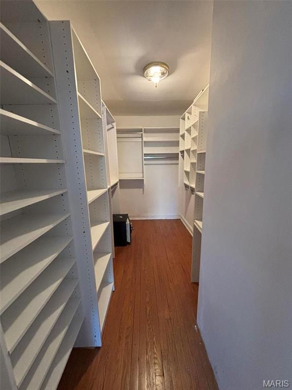 7810 Lafon Pl, University City, MO 63130 - walk in closet with dark wood finished floors