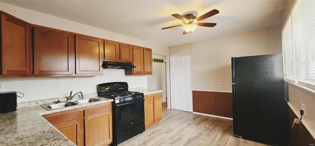 10417 Tanner Dr, Saint Louis, MO 63136 - kitchen featuring black appliances, under cabinet range hood, a sink, a ceiling fan, and light countertops