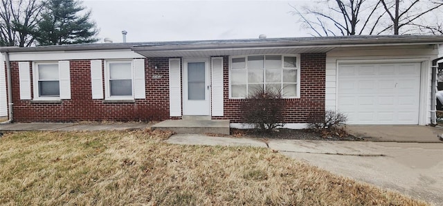 10417 Tanner Dr, Saint Louis, MO 63136 - ranch-style home with brick siding, a garage, and concrete driveway