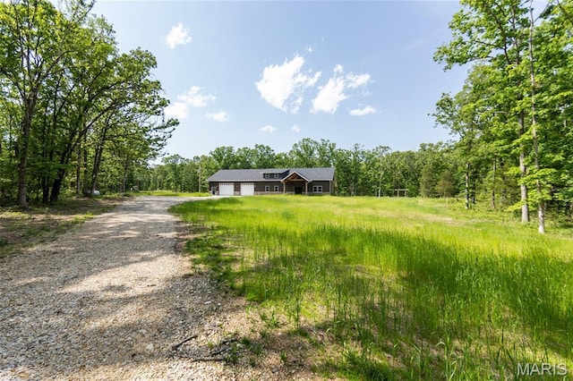 20167 County Road 7300, Newburg, MO 65560 - view of front of home featuring gravel driveway and a view of trees