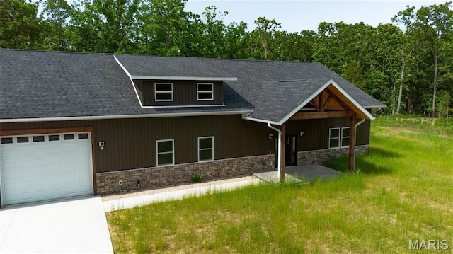 20167 County Road 7300, Newburg, MO 65560 - view of front facade featuring stone siding, an attached garage, driveway, a shingled roof, and a view of trees