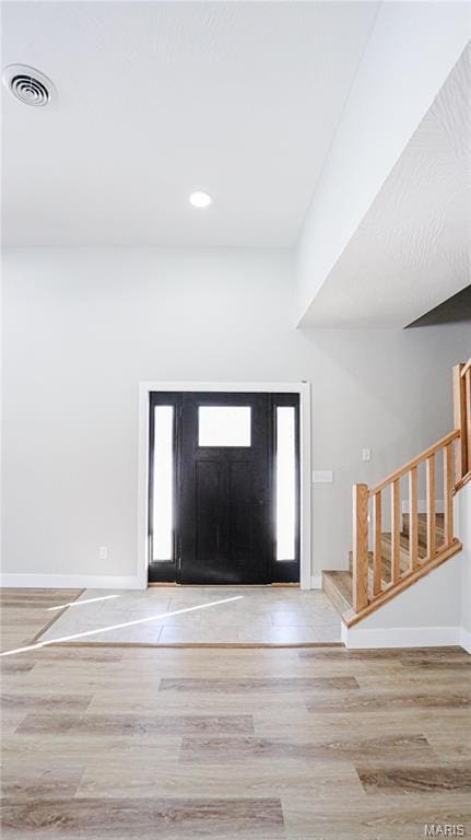 20167 County Road 7300, Newburg, MO 65560 - entryway featuring wood finished floors, stairs, baseboards, and recessed lighting