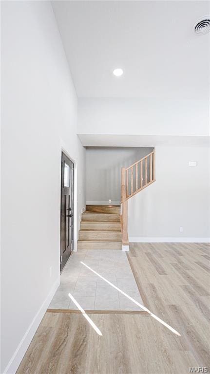 20167 County Road 7300, Newburg, MO 65560 - staircase featuring wood finished floors, baseboards, and recessed lighting
