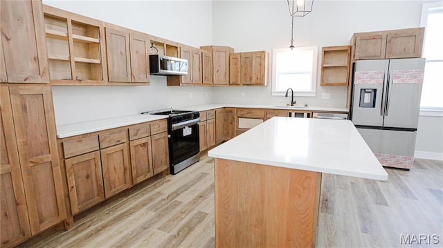 20167 County Road 7300, Newburg, MO 65560 - kitchen featuring stainless steel appliances, open shelves, light wood-type flooring, a center island, and a towering ceiling